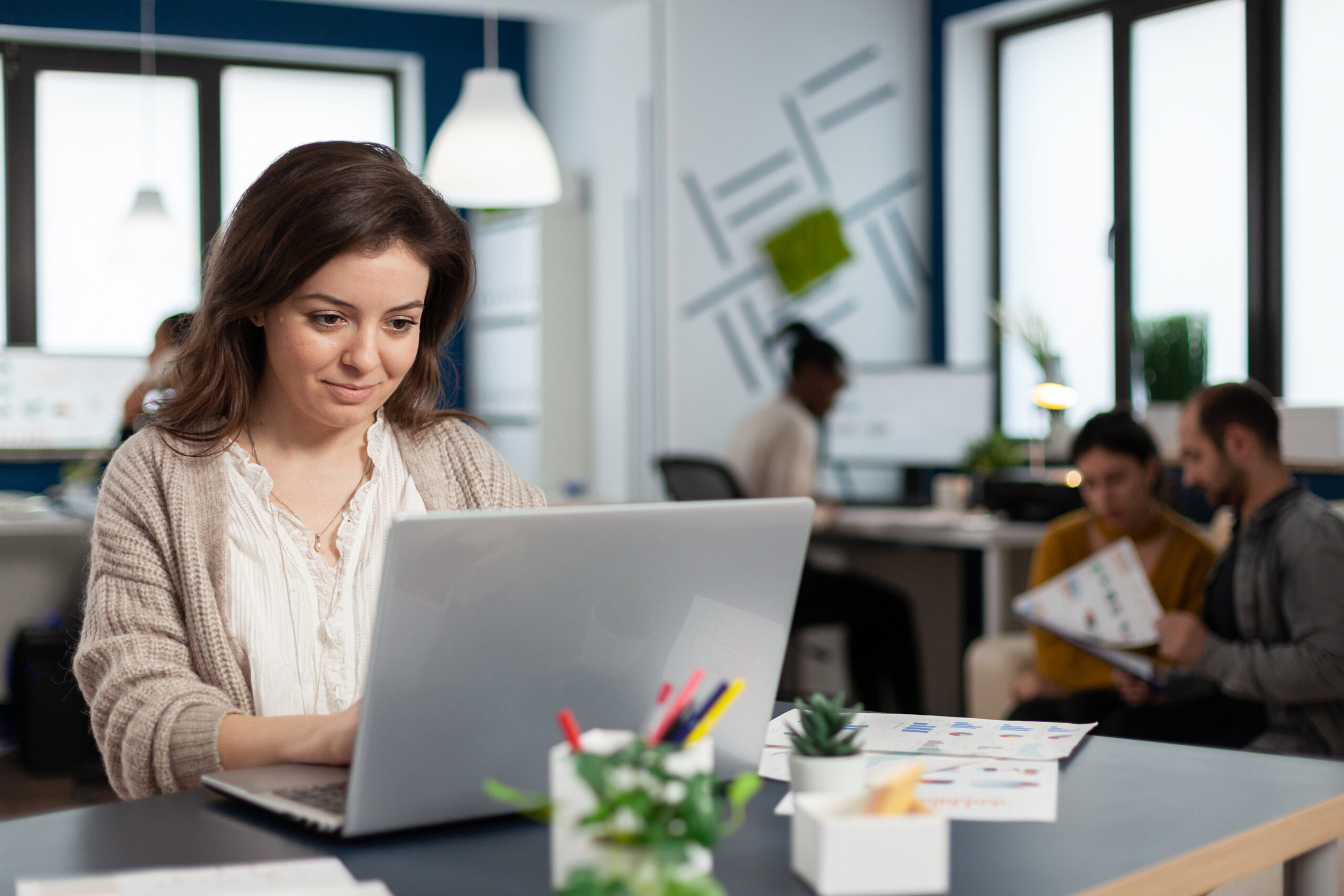 close up of satisfied businesswoman answering email